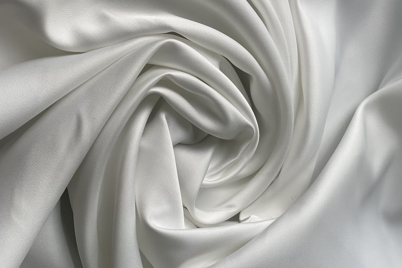 Blackout satin rolled in a circle 326429