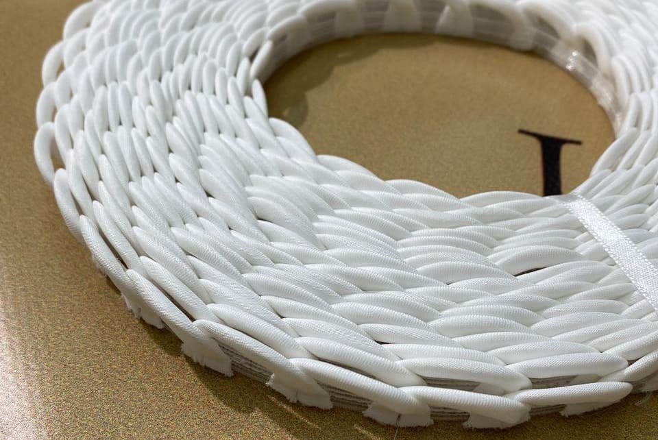 ivory corset loops on boning, rolled close-up 328870